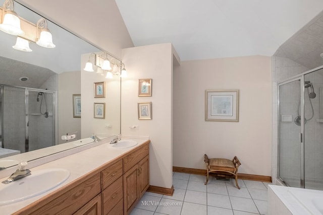 bathroom featuring tile patterned floors, lofted ceiling, plus walk in shower, and vanity