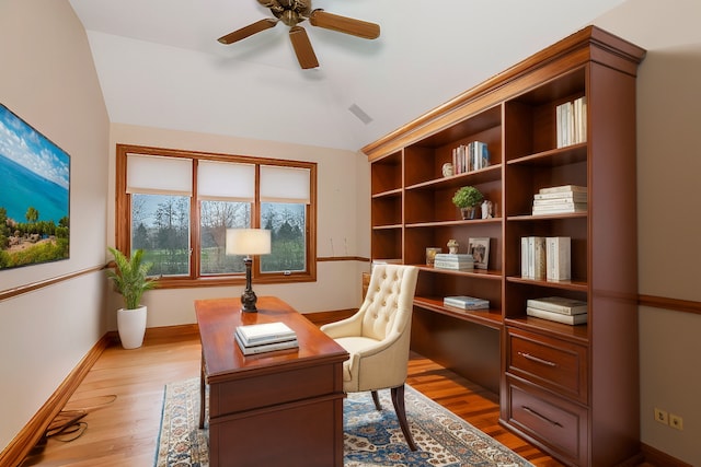 office space featuring vaulted ceiling, ceiling fan, and light hardwood / wood-style floors