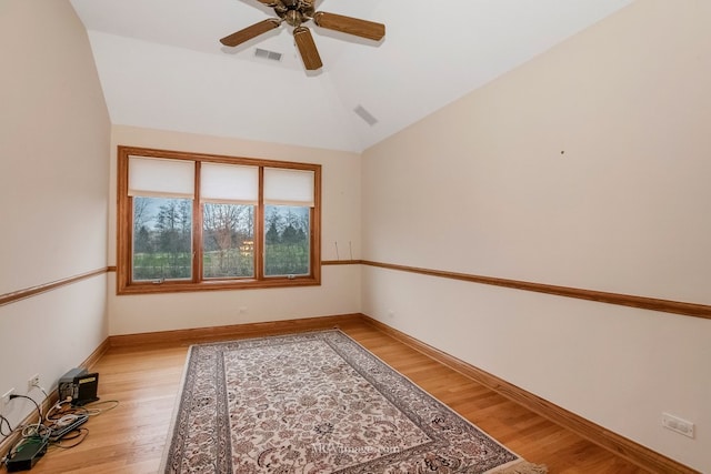 unfurnished room featuring vaulted ceiling, light hardwood / wood-style floors, and ceiling fan