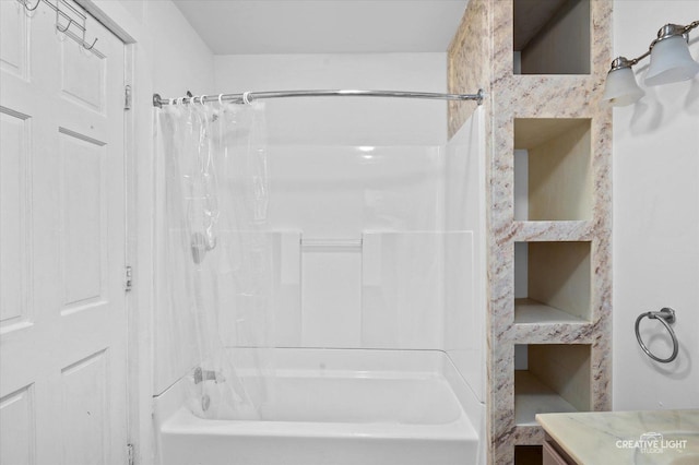 bathroom featuring vanity and shower / bath combo