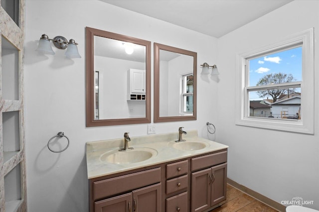 bathroom with wood-type flooring and vanity