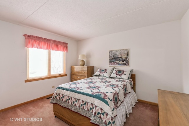 carpeted bedroom with a textured ceiling