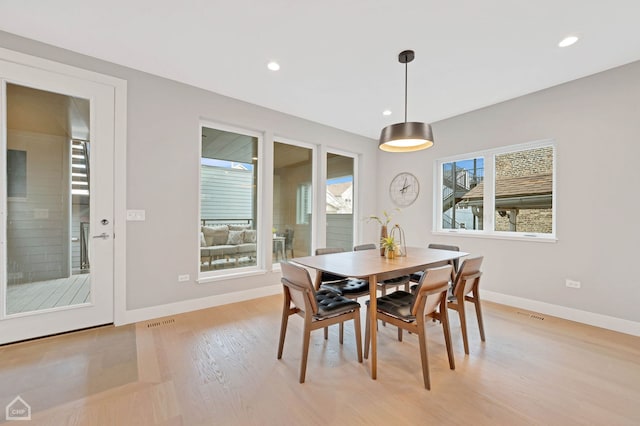 dining area featuring light hardwood / wood-style floors and a wealth of natural light