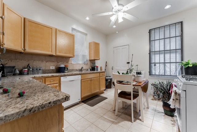 kitchen featuring light tile patterned floors, white appliances, light stone counters, tasteful backsplash, and light brown cabinets