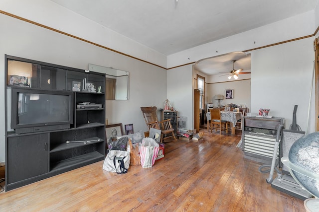 interior space with wood-type flooring and ceiling fan