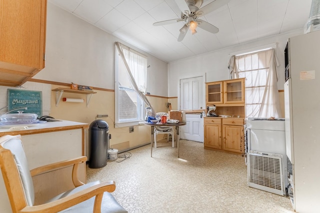 miscellaneous room featuring plenty of natural light and ceiling fan