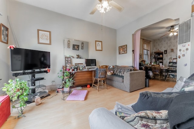 living room with ceiling fan and wood-type flooring