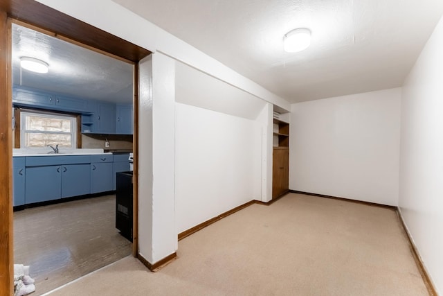 bonus room with carpet floors and a textured ceiling