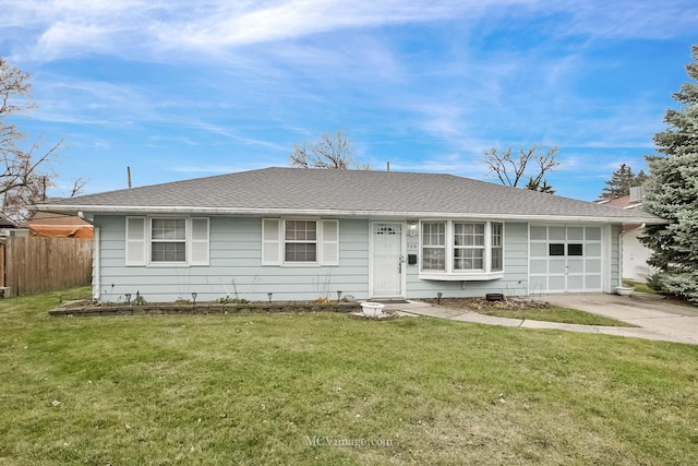 ranch-style house with a garage and a front yard