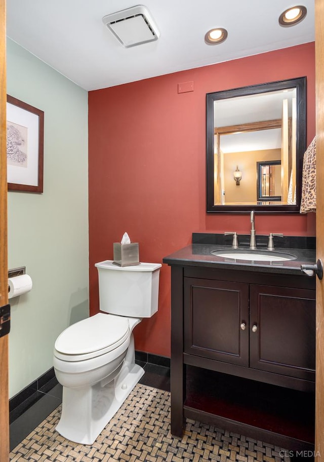 bathroom featuring tile patterned floors, toilet, and vanity