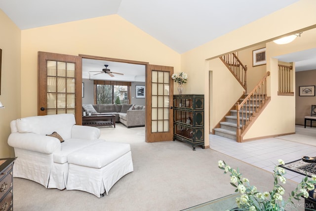 living area with light carpet and lofted ceiling