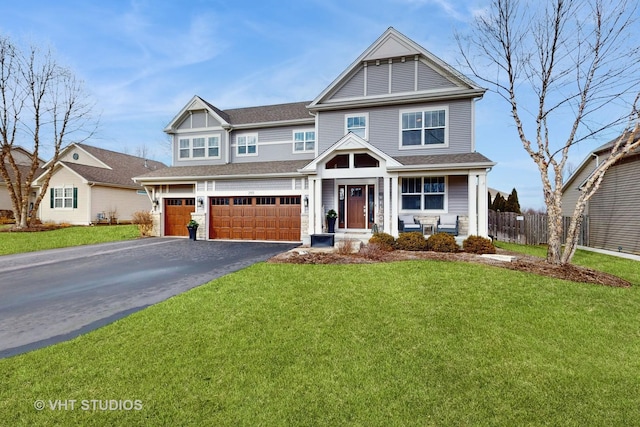 view of front of house featuring a garage and a front yard