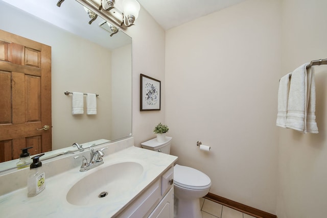 bathroom with vanity, tile patterned floors, and toilet