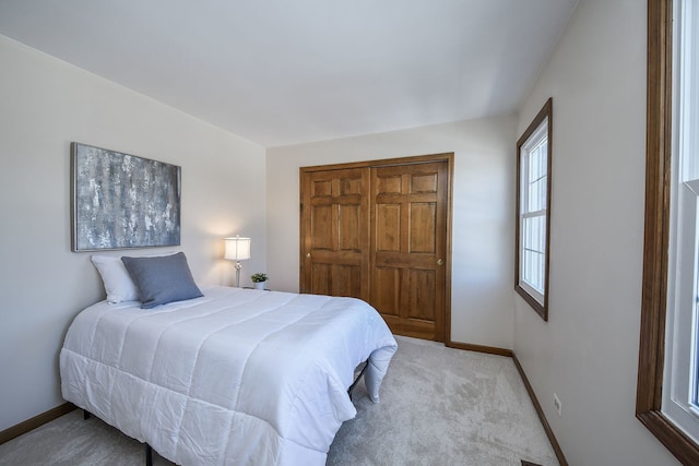 bedroom featuring light colored carpet