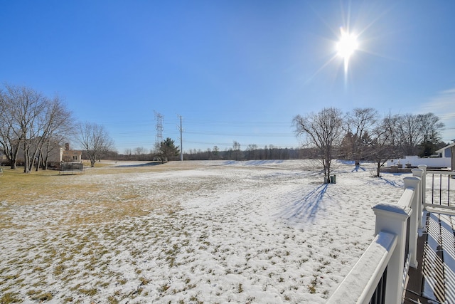 view of yard layered in snow