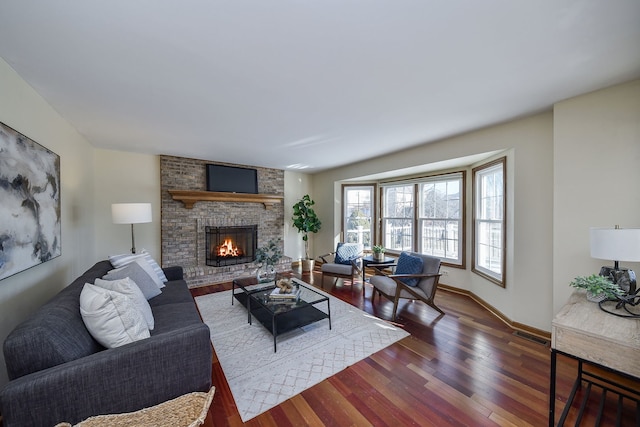 living room with dark wood-type flooring and a fireplace