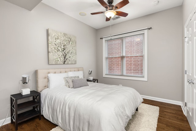 bedroom featuring dark hardwood / wood-style floors and ceiling fan