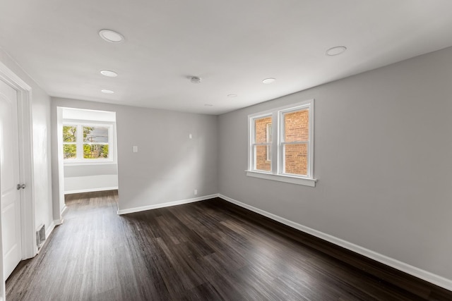 unfurnished room featuring dark hardwood / wood-style floors