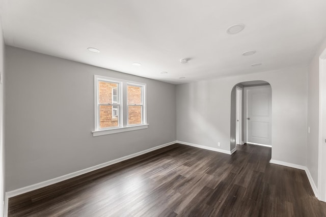 unfurnished room featuring dark hardwood / wood-style floors