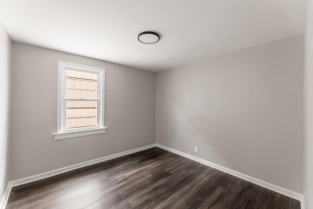 empty room featuring dark wood-type flooring