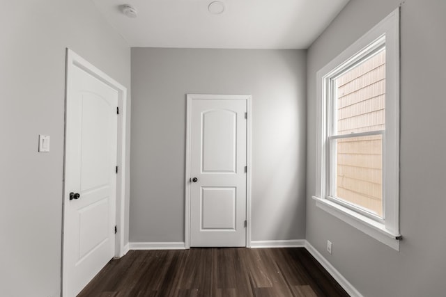 unfurnished bedroom featuring dark hardwood / wood-style floors