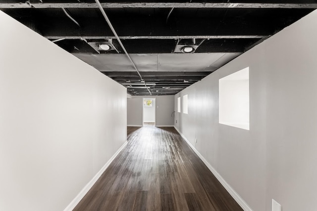 hall with dark wood-type flooring