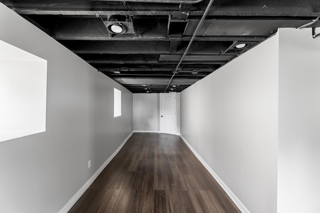 hall with hardwood / wood-style flooring