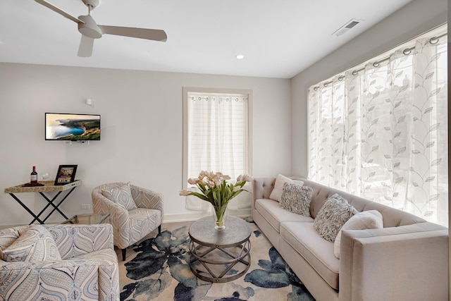 living room featuring ceiling fan