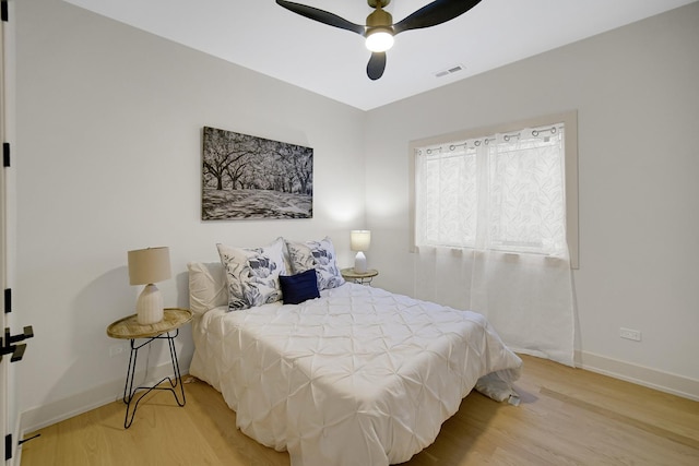 bedroom featuring wood-type flooring and ceiling fan