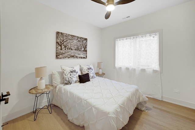 bedroom featuring hardwood / wood-style floors and ceiling fan