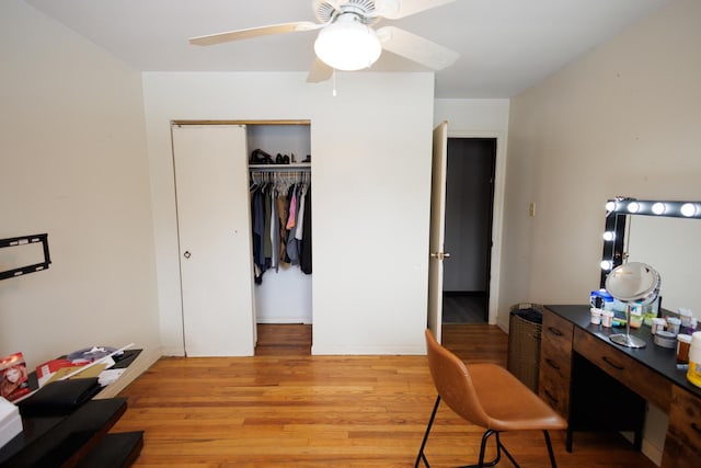 office space featuring ceiling fan and light wood-type flooring