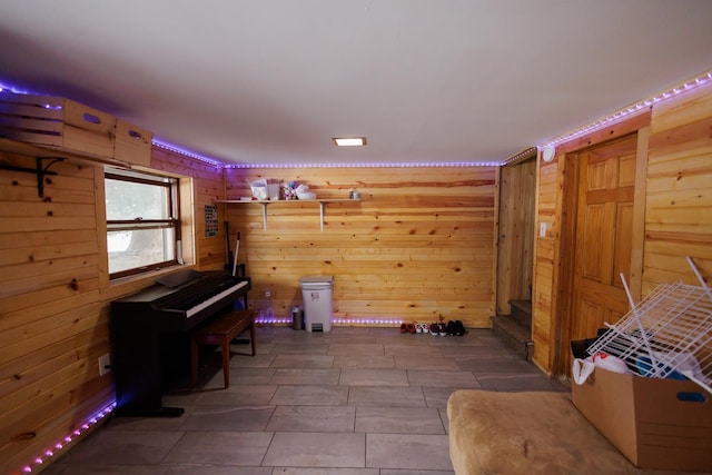 miscellaneous room with wood walls