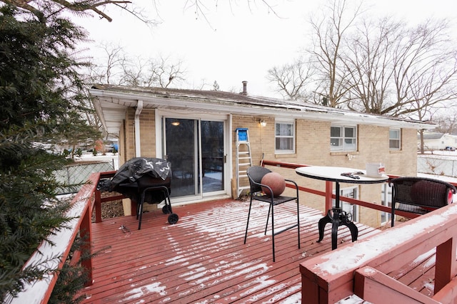 wooden terrace featuring grilling area