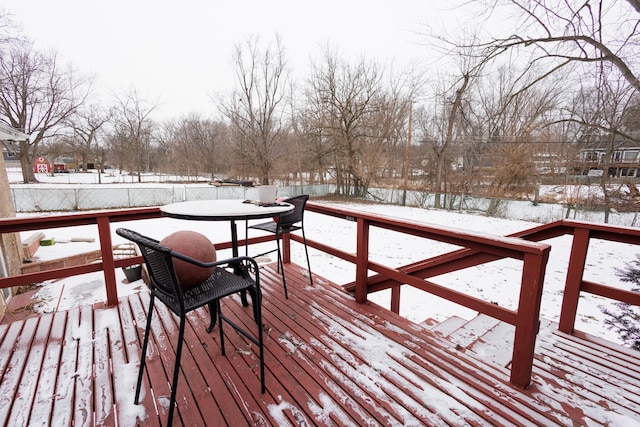 view of snow covered deck