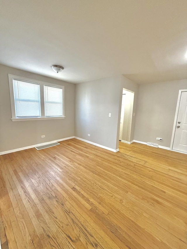 unfurnished room with light hardwood / wood-style flooring