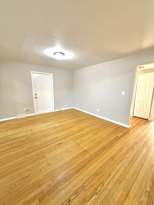 unfurnished room with light hardwood / wood-style floors