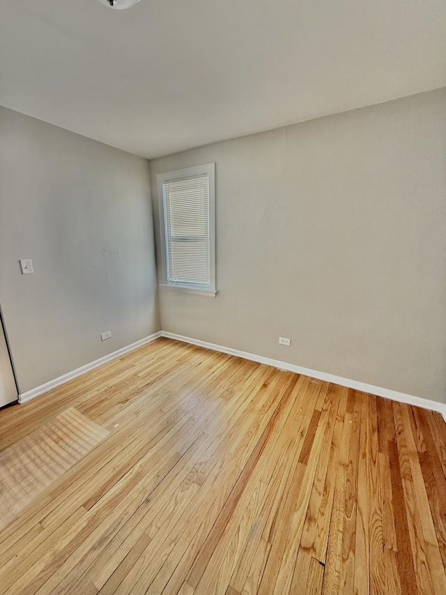 spare room with light wood-type flooring