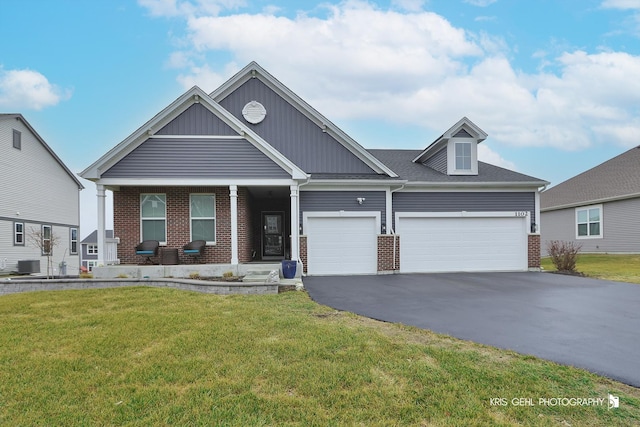 craftsman inspired home with central AC, a garage, and a front lawn