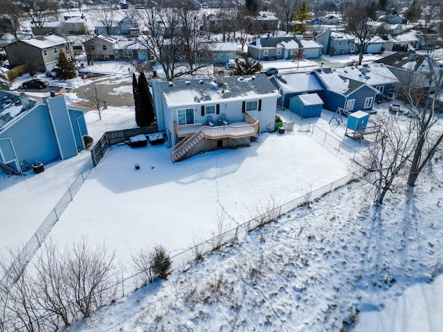 snowy aerial view with a residential view