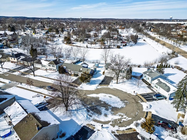 snowy aerial view featuring a residential view