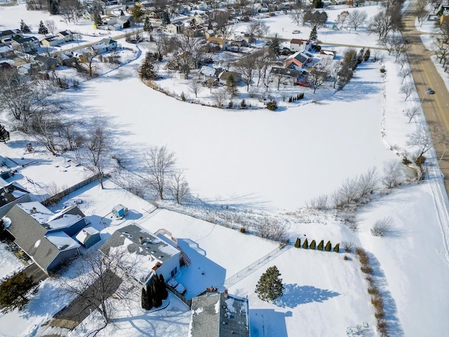 snowy aerial view featuring a residential view