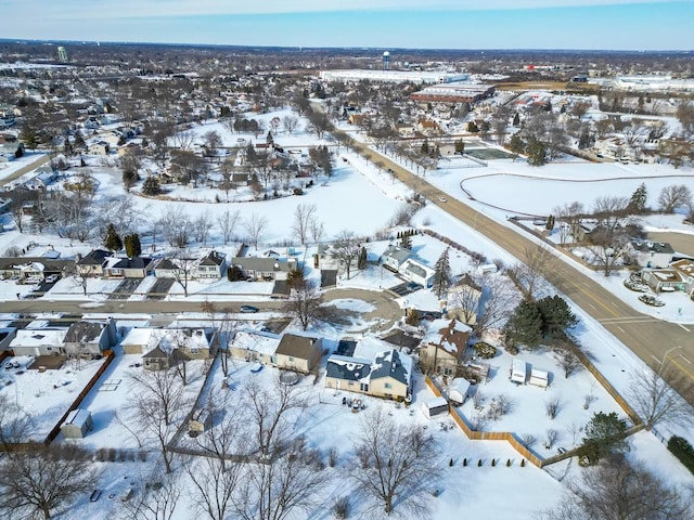 snowy aerial view featuring a residential view