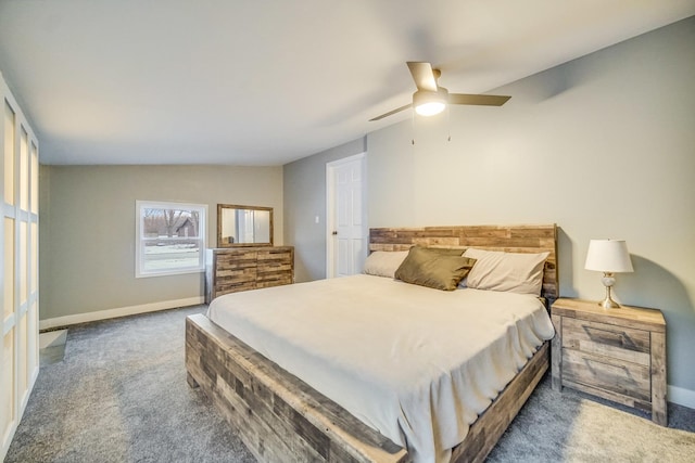 bedroom featuring dark carpet and ceiling fan