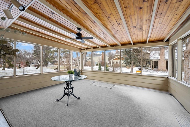 unfurnished sunroom with wood ceiling and ceiling fan