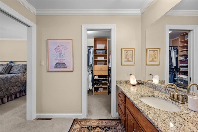 bathroom featuring vanity and crown molding