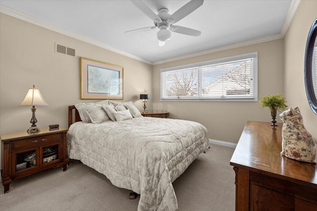 carpeted bedroom featuring ceiling fan and ornamental molding