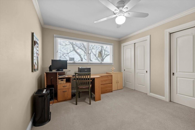 carpeted office featuring ornamental molding and ceiling fan