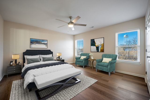 bedroom with dark wood-type flooring and ceiling fan