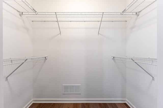 spacious closet featuring hardwood / wood-style flooring