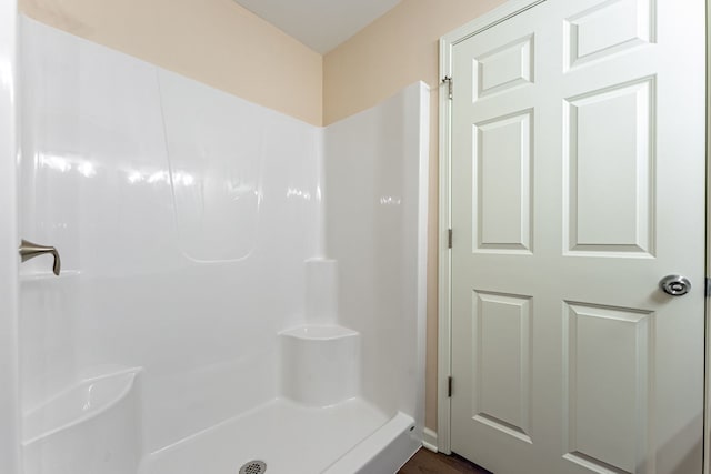 bathroom featuring walk in shower